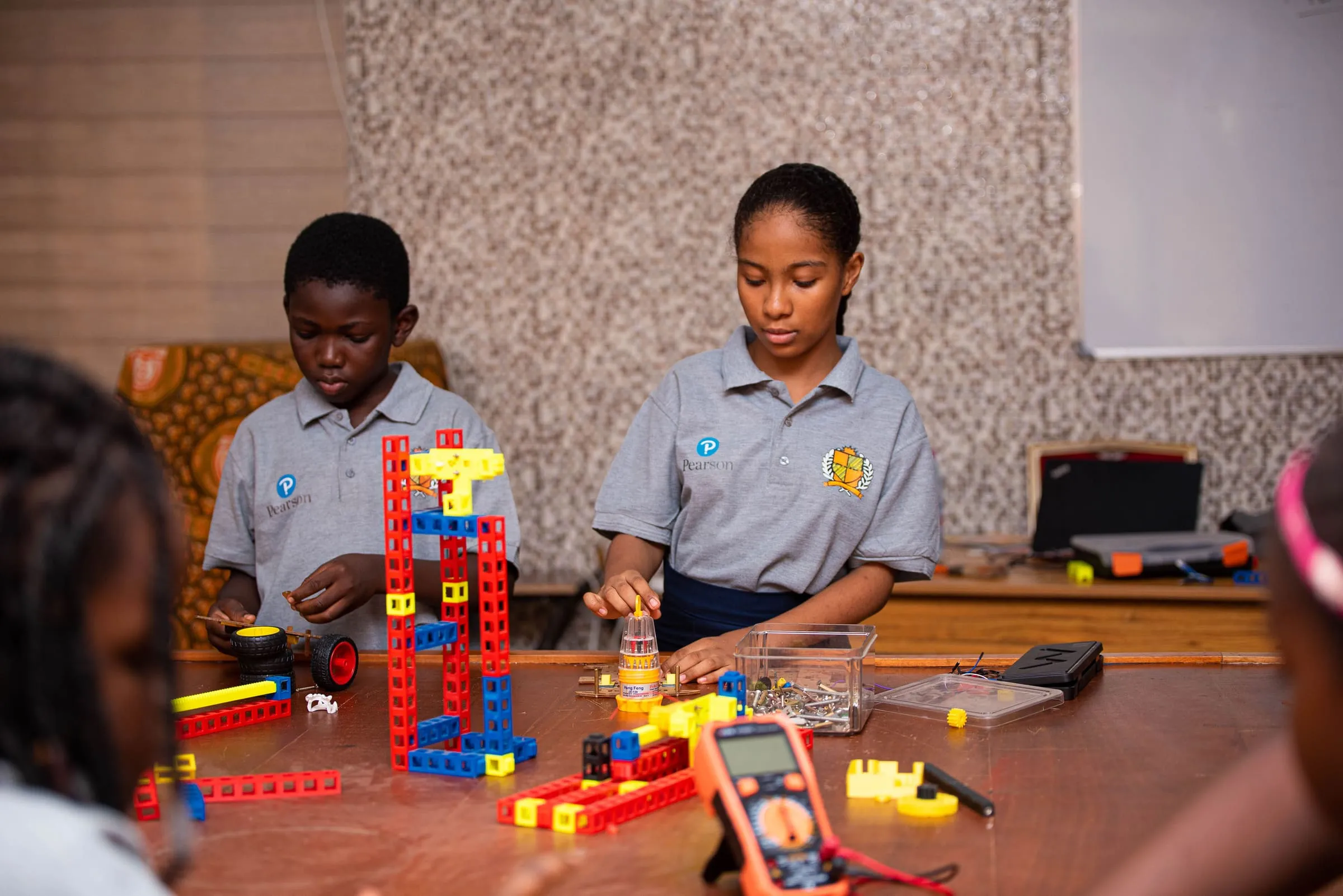 Crystal Heights students building models in the robotics studio